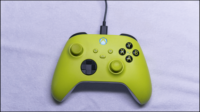 Green Xbox controller with cable.